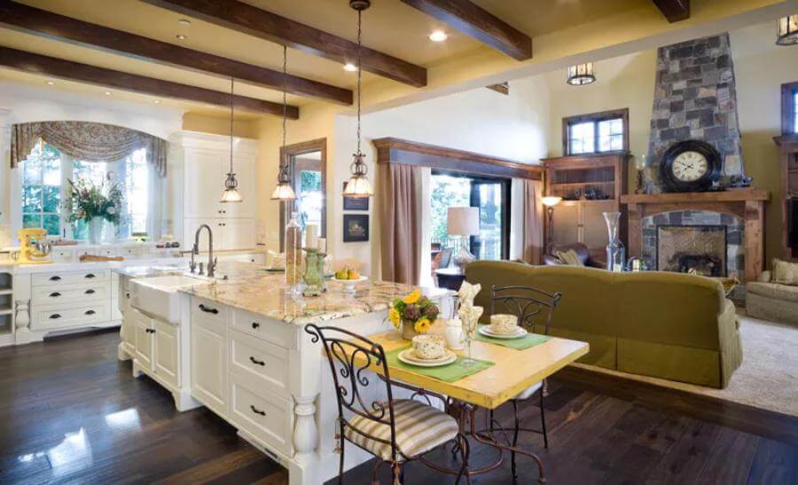 Kitchen island complete with a farmhouse sink overlooking the great room.