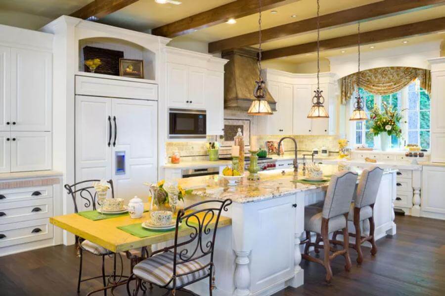 Kitchen featuring white cabinets and a center island, integrated with an eating counter.