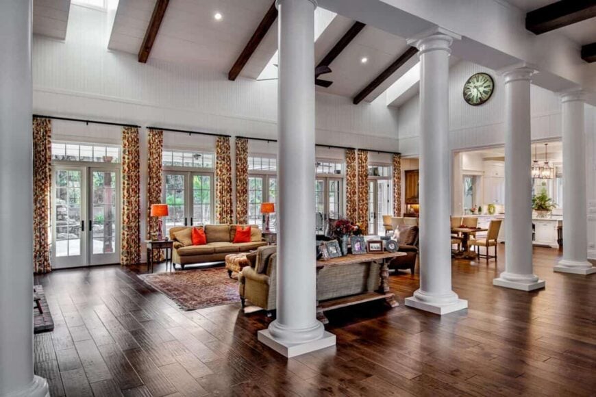 Living area divided from the foyer by four elegant columns.