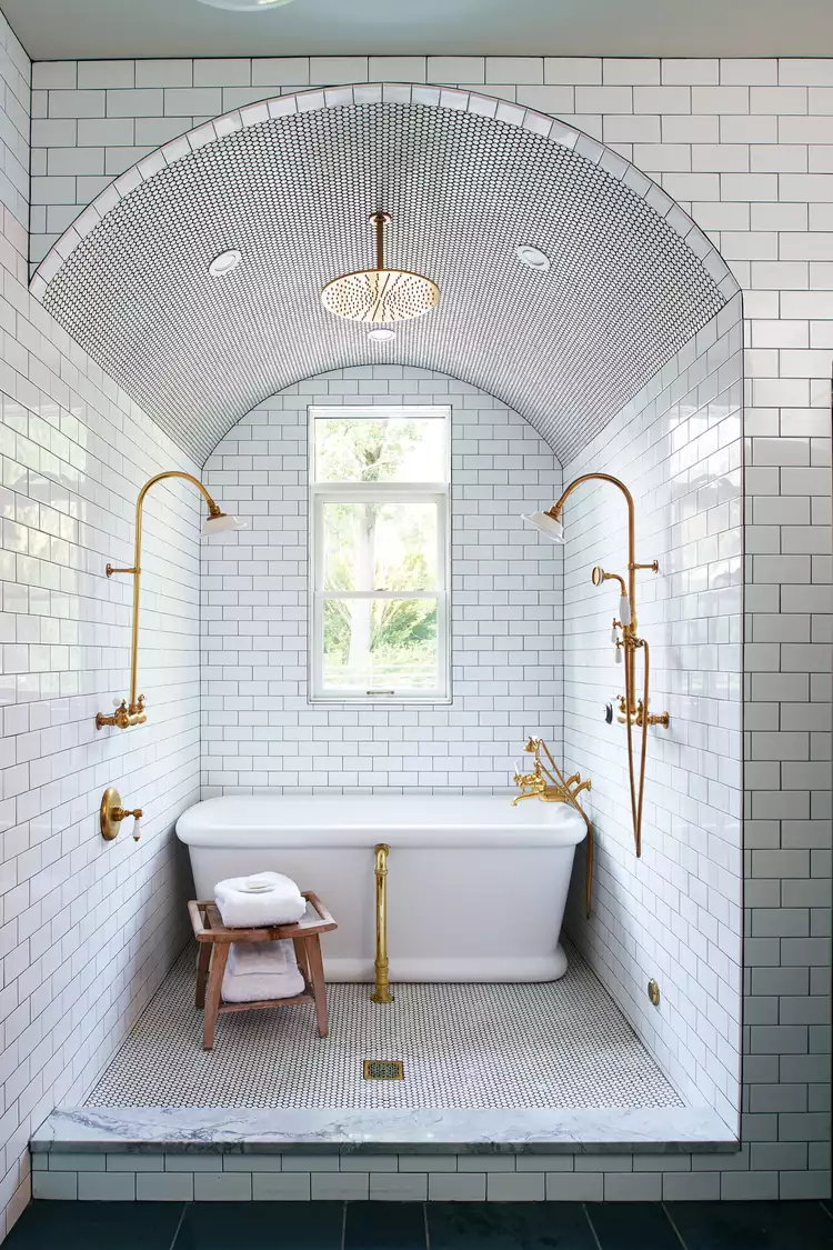 17 Doorless Shower Ideas for a Calming, Simplified Look 45 arched doorless shower tile subway tile tub gold
