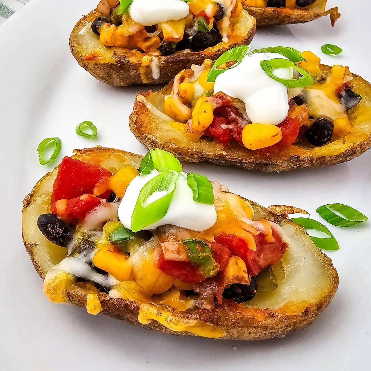 Cheesy Southwest Potato Skins 1 southwest potato skin featured image