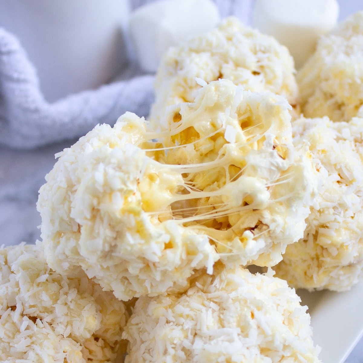 Gooey Coconut Popcorn Marshmallow Snowball Bites 1 coconut popcorn snowballs featured image