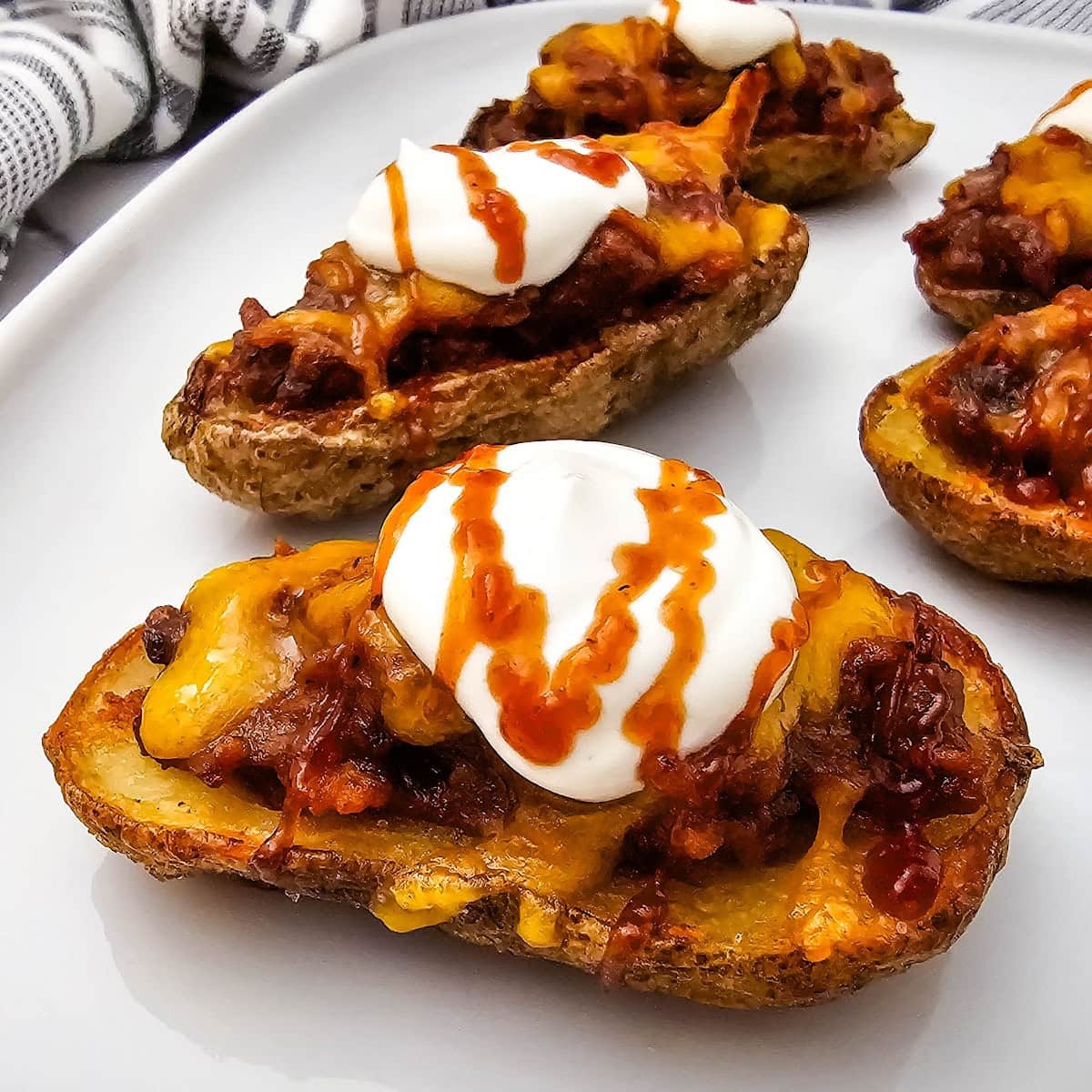 Crispy Pulled Pork and Cheese Potato Skins 1 pulled pork potato skins featured image