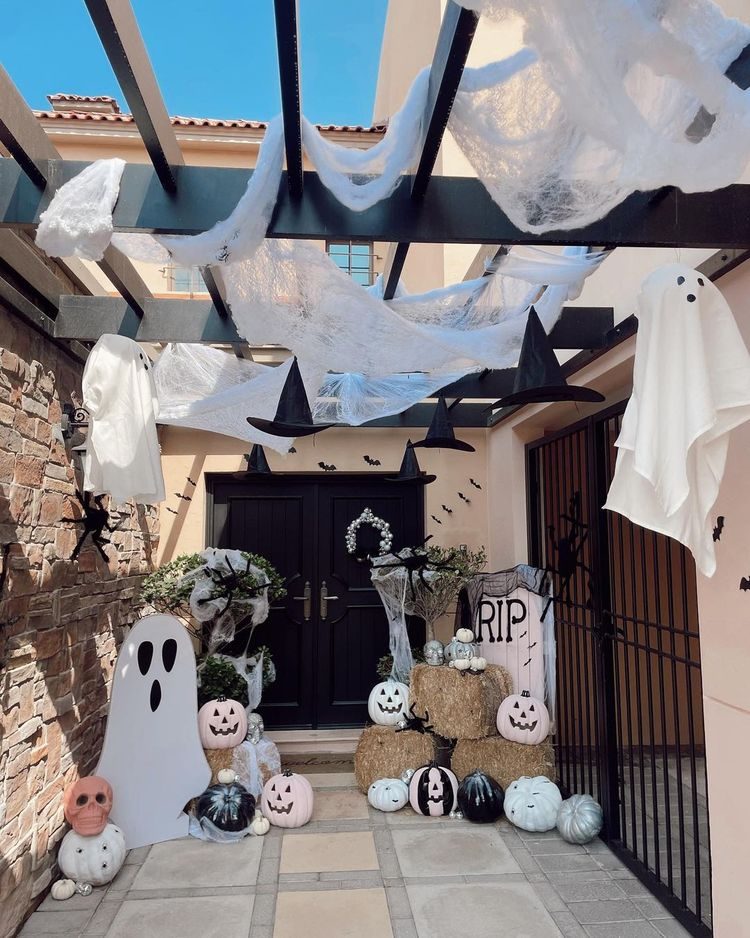 Halloween porch with ghosts and witches hats
