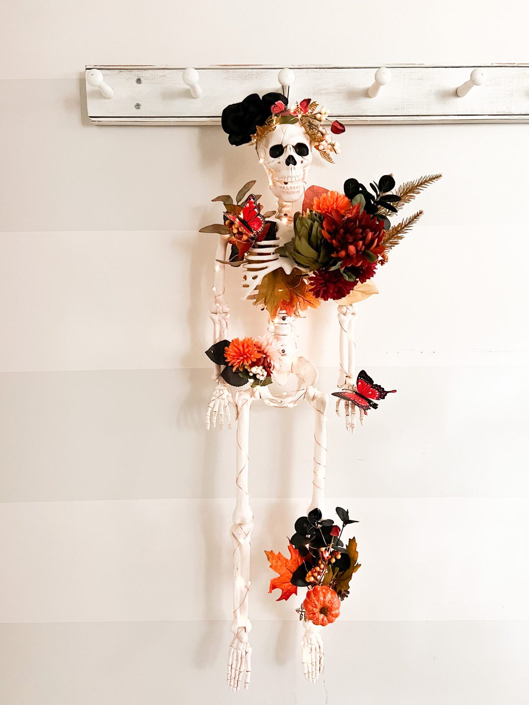Front door with Halloween decorated planters on either side