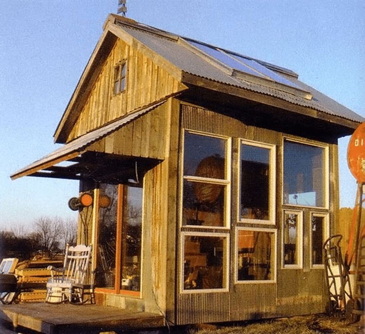 Solar greenhouse with a sleeping loft and angled glazing