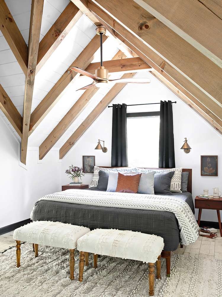 White bedroom with exposed wood beams