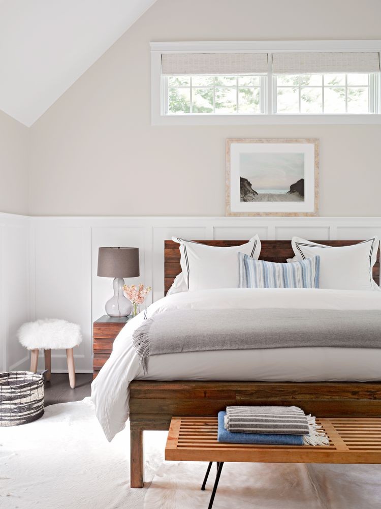 Light gray bedroom with white wainscoting
